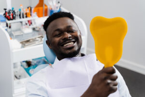 man happy with dental work root canal concept